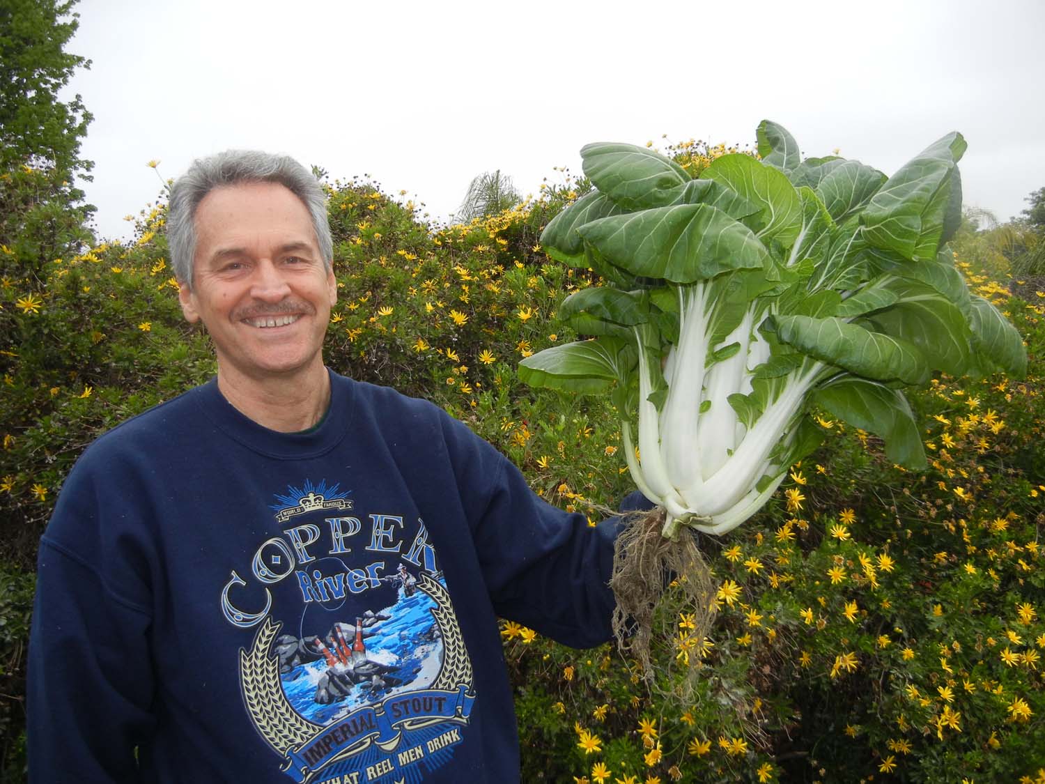Colle Davis, Lead Inventor, Portable Farms® Aquaponics Systems harvesting a PRIZE WINNING 17-lb bok choy. Oh the joys of aquaponics . . . the fun just never ends! :)